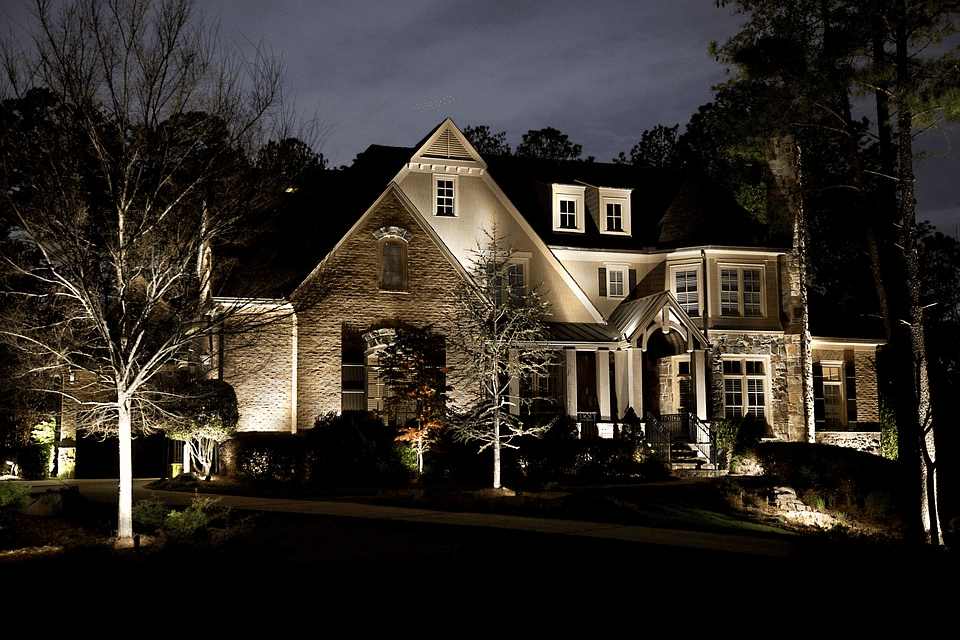 Front of a house with landscape lighting design
